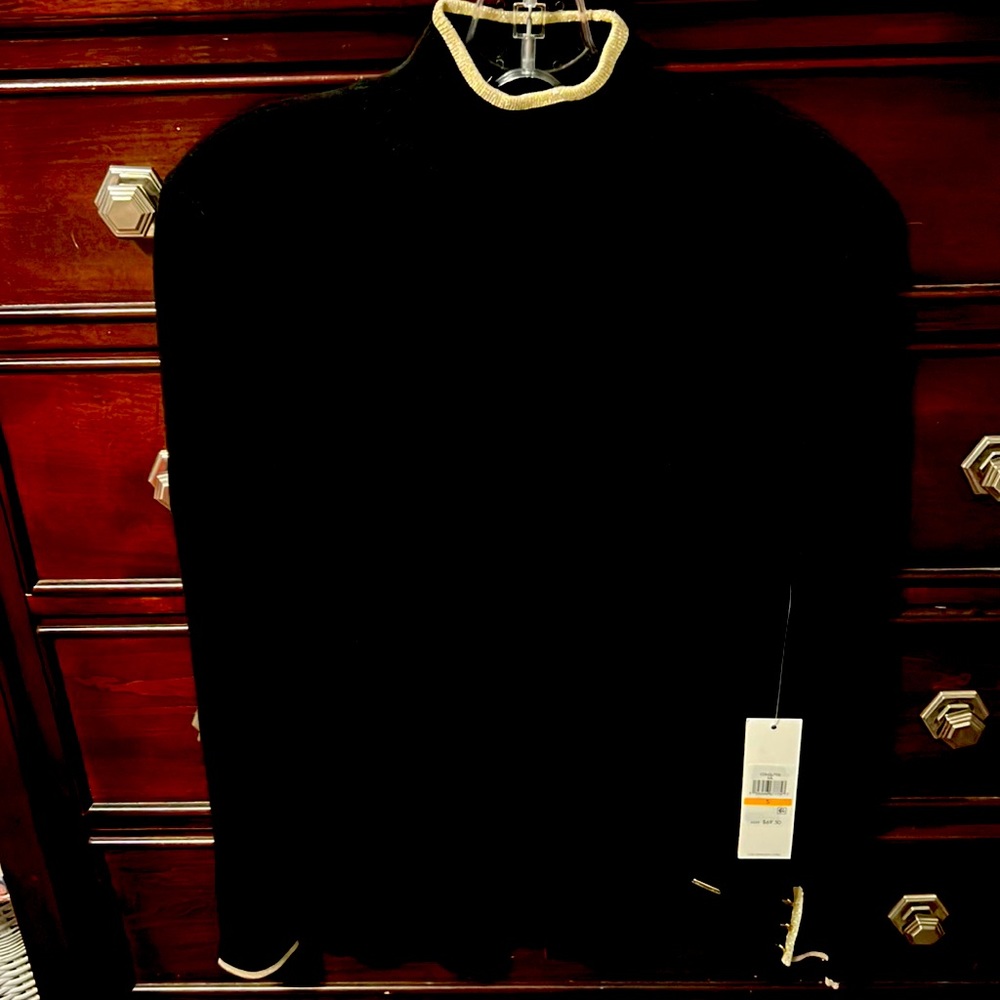 Calvin Klein S P black with gold trim and gold buttons on sleeves.